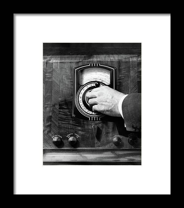 Photography Framed Print featuring the photograph 1930s Close Up Mans Hand Turning Radio by Vintage Images