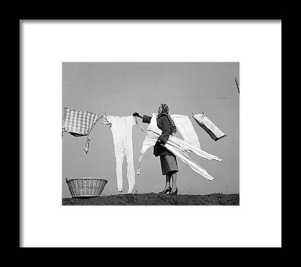 Photography Framed Print featuring the photograph 1950s Housewife Removing Frozen Long by Vintage Images