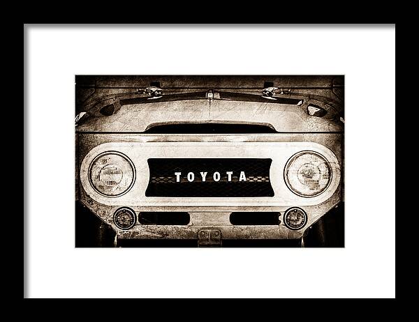 1969 Toyota Fj-40 Land Cruiser Grille Emblem Framed Print featuring the photograph 1969 Toyota FJ-40 Land Cruiser Grille Emblem -0444s by Jill Reger