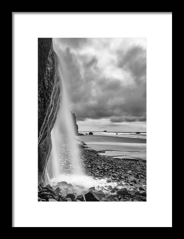 Vertical Framed Print featuring the photograph Falling into the Sea by Jon Glaser