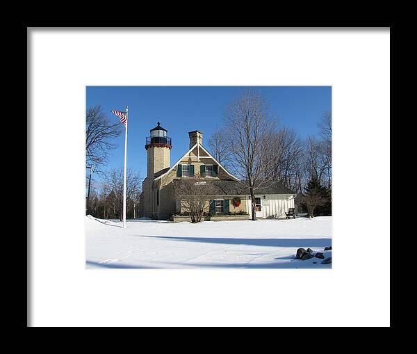 Winter Framed Print featuring the photograph McGulpin Point Lighthouse in Winter by Keith Stokes