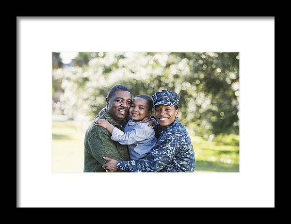 4-5 Years Framed Print featuring the photograph Military homecoming, navy servicewoman with family #2 by Kali9