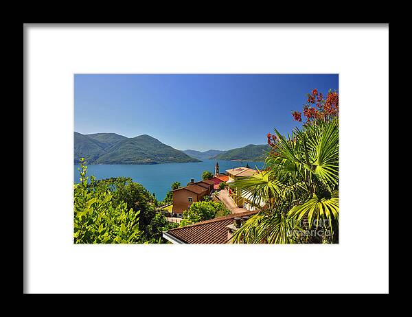 Panoramic View Framed Print featuring the photograph Panoramic view over an alpine lake #3 by Mats Silvan