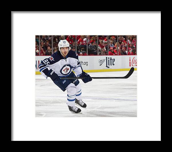 Following Framed Print featuring the photograph Winnipeg Jets V Detroit Red Wings #4 by Dave Reginek