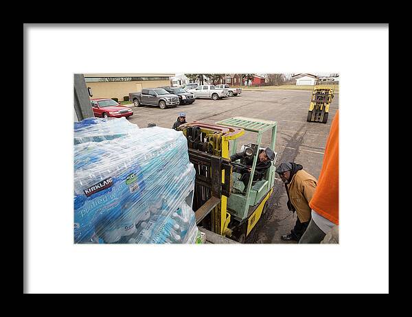Flint Water Crisis Framed Print featuring the photograph Flint Bottled Drinking Water Distribution #5 by Jim West