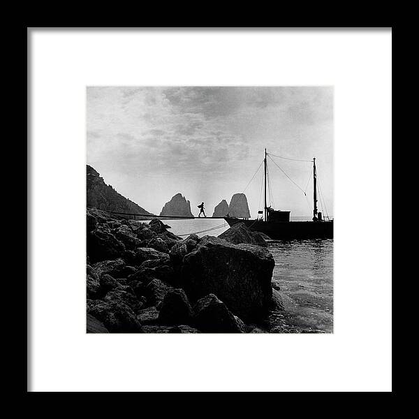 Capri Framed Print featuring the photograph A Boat Docked At Capri by Clifford Coffin
