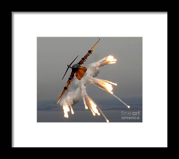Color Image Framed Print featuring the photograph A C-17 Globemaster IIi Releases Flares by Stocktrek Images