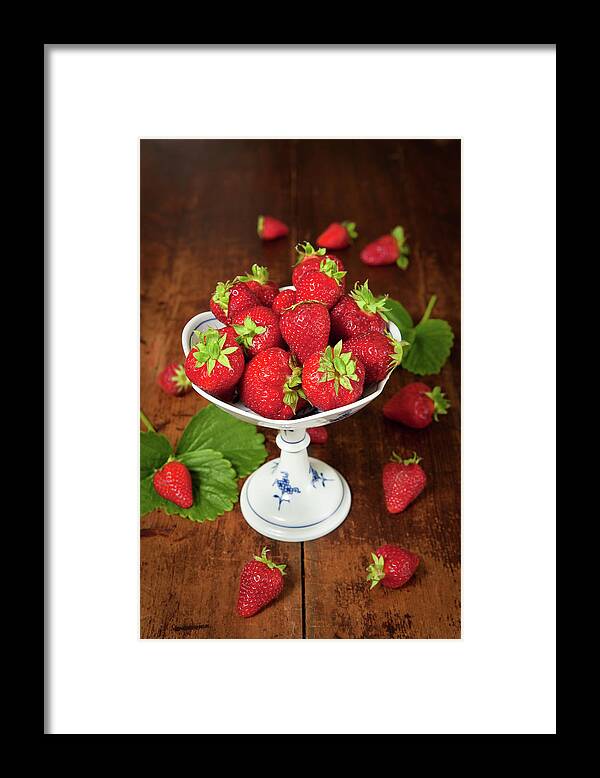 Crockery Framed Print featuring the photograph A Dish Of Fresh Strawberries On A by Ursula Alter