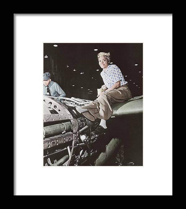 Vertical Framed Print featuring the photograph A Female Riveter Working by Stocktrek Images