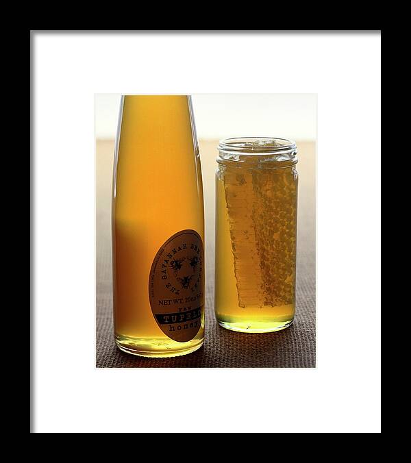 Condiment Framed Print featuring the photograph A Jar And Bottle Of Honey by Romulo Yanes