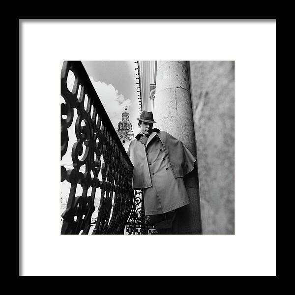 Model Framed Print featuring the photograph A Male Model Wearing A Cape By Rain-over Standing by Leonard Nones