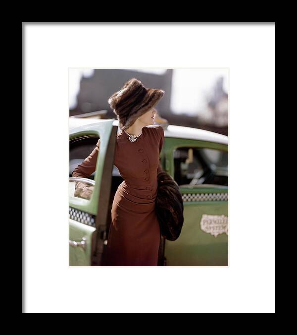 Fashion Framed Print featuring the photograph A Model Getting Out Of A Cab by Constantin Joffe