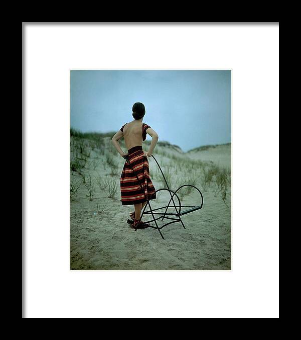 Fashion Framed Print featuring the photograph A Model On A Beach by Serge Balkin