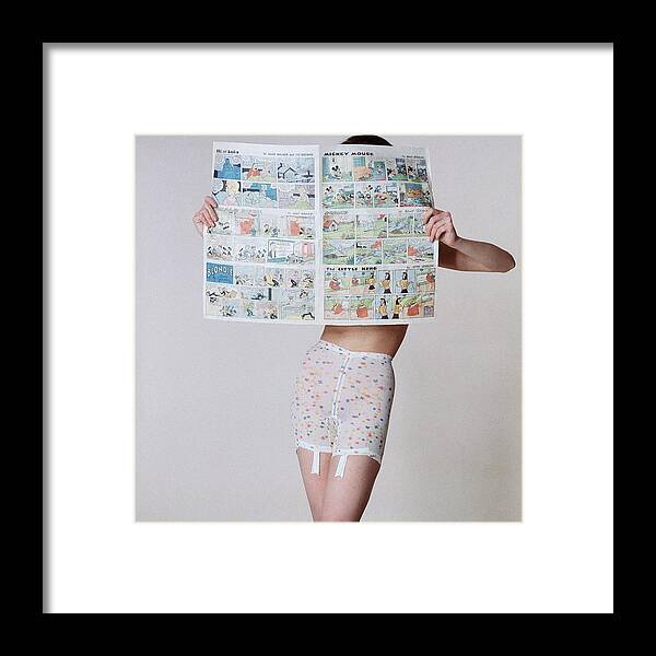 A Model Wearing A Girdle With A Comic Framed Print by Louis Faurer - Conde  Nast