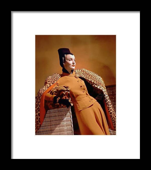 Accessories Framed Print featuring the photograph A Model Wearing A Leopard Print Cape And Orange by Horst P. Horst