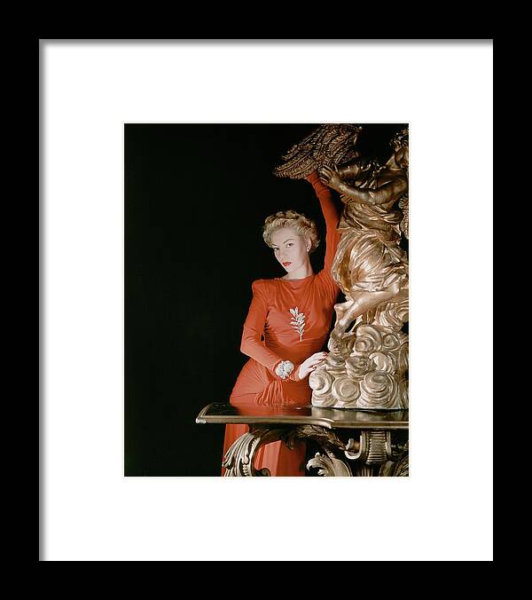 Fashion Framed Print featuring the photograph A Model Wearing A Silk Jersey Dress by Horst P. Horst