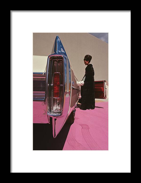 Auto Framed Print featuring the photograph A Model Wearing Emeric Partos Entering A 1965 by Gene Laurents
