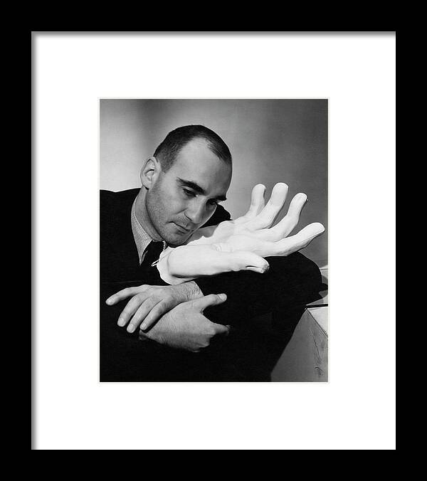 Decorative Art Framed Print featuring the photograph A Portrait Of Boris Kochno Hugging An Oversized by Cecil Beaton