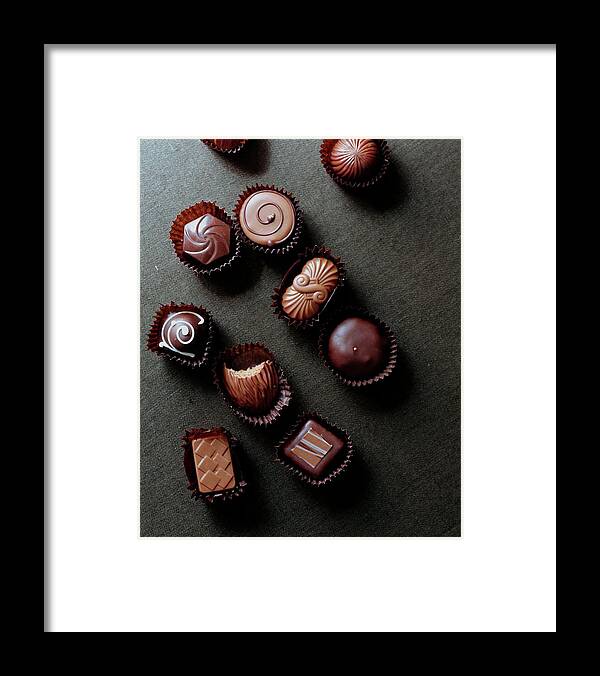 Cooking Framed Print featuring the photograph A Selection Of Chocolates by Romulo Yanes