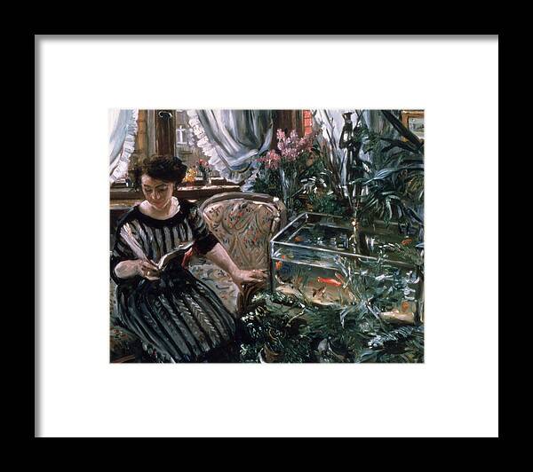 Goldfish Framed Print featuring the painting A Woman Reading near a Goldfish Tank by Lovis Corinth