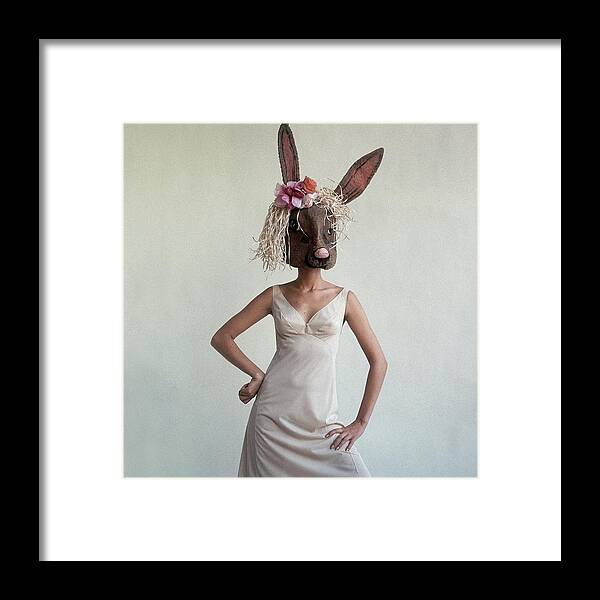 Fashion Framed Print featuring the photograph A Woman Wearing A Rabbit Mask by Gianni Penati