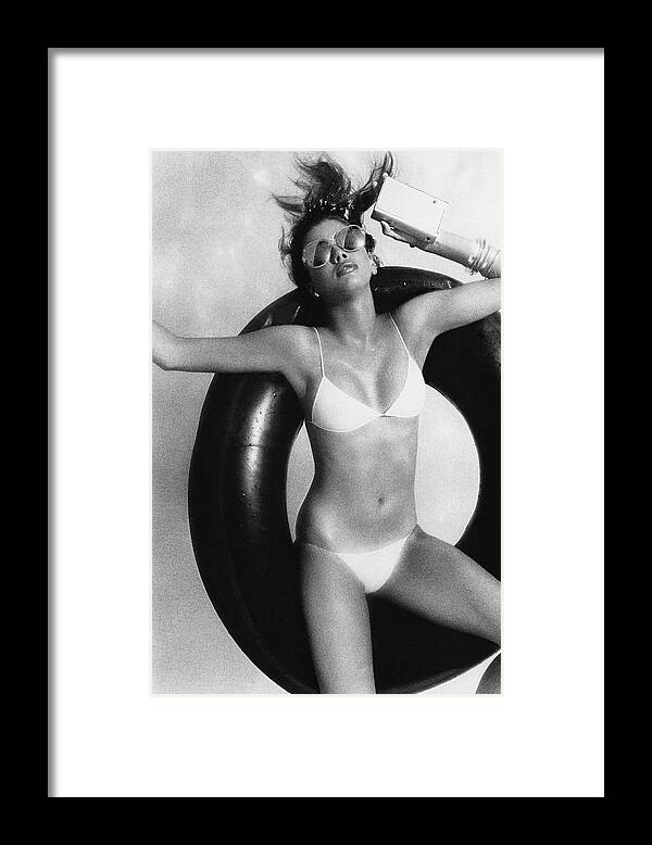 Accessories Framed Print featuring the photograph Debbie Dickinson Floating On An Inner Tube by Albert Watson