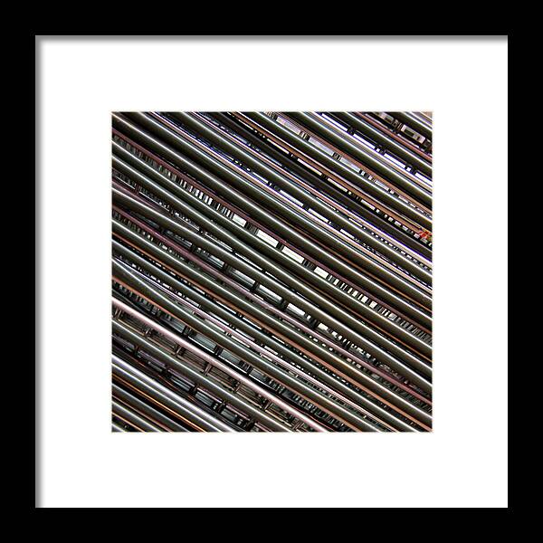 In A Row Framed Print featuring the photograph Abstract View Of Shopping Baskets by Andrea Kennard Photography