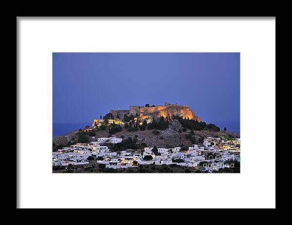 Rhodes Framed Print featuring the photograph Acropolis and village of Lindos during dusk time by George Atsametakis