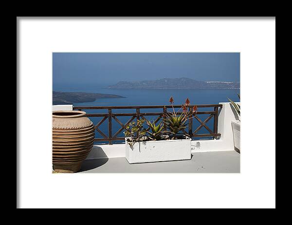 Sunny Terrace In Fira The Capital Town On The Island Of Santorini In The Cyclades Island In Greece.santorini Is Essentially What Remains After An Enormous Volcanic Explosion That Destroyed The Earliest Settlements On A Formerly Single Island Framed Print featuring the photograph Aegean Dreaming by Brenda Kean