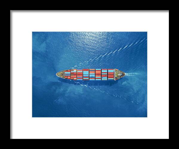Trading Framed Print featuring the photograph aerial top view container ship Park for import export logistics in pier, thailand. by Anucha Sirivisansuwan