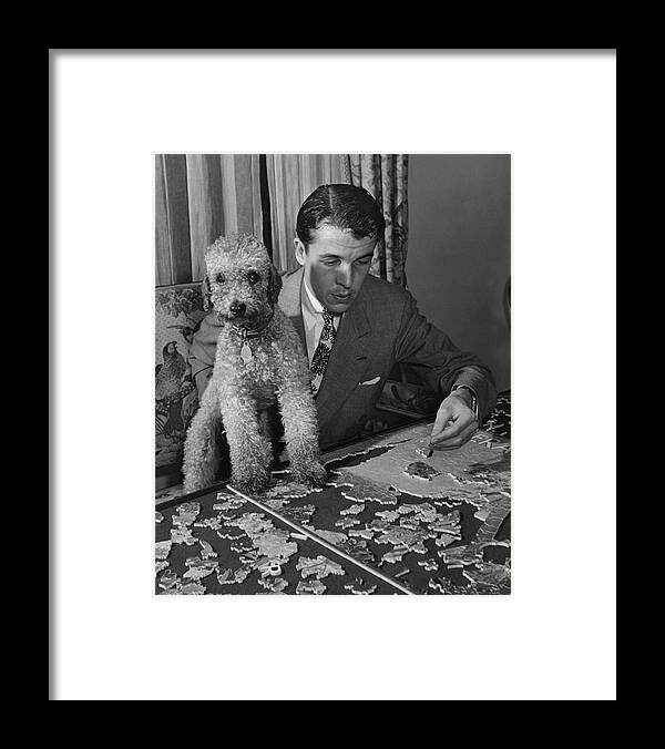 One Person Framed Print featuring the photograph Alfred Gwynne Vanderbilt Completing A Puzzle by John Swope