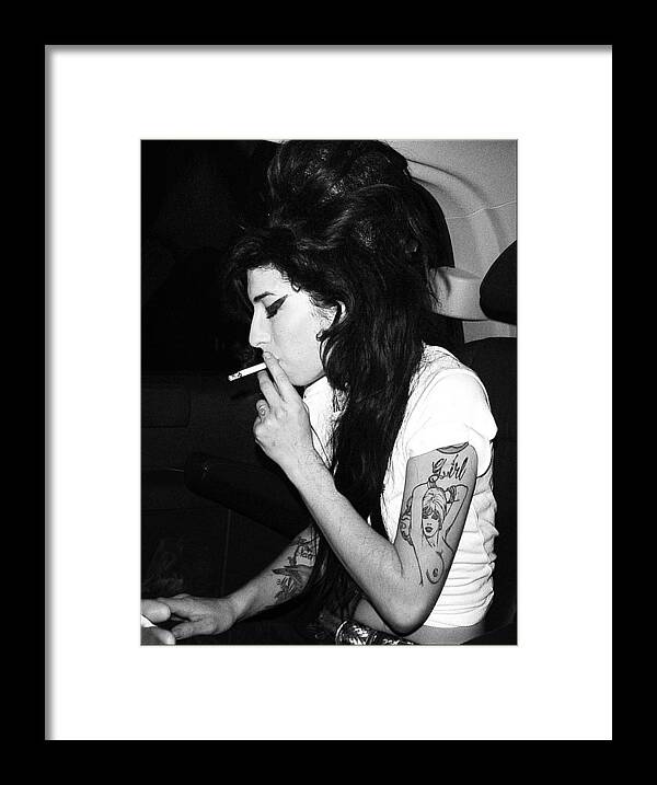 Amy Winehouse Framed Print featuring the photograph Amy Winehouse by Paul Sutcliffe