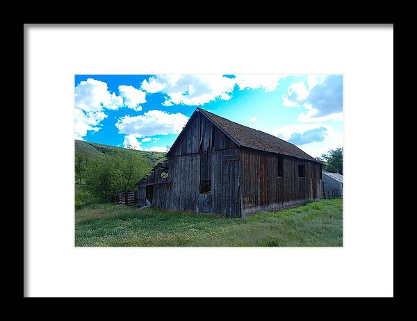 Barns Framed Print featuring the photograph An old barn in the sage by Jeff Swan