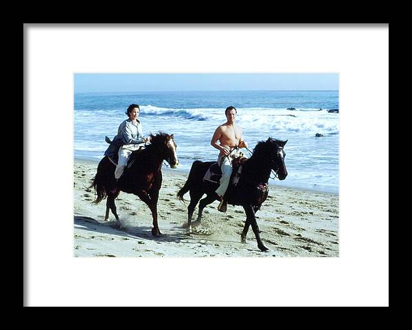 Actress Framed Print featuring the photograph Andie Macdowell And Paul Qualley Riding Horses by Arthur Elgort