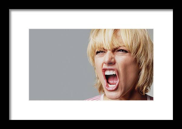 People Framed Print featuring the photograph Angry young woman by Peter Dazeley