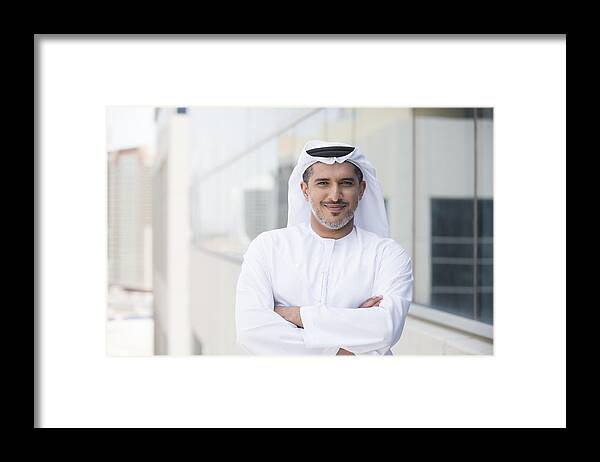 Arabia Framed Print featuring the photograph Arab businessman portrait outside office building by JohnnyGreig