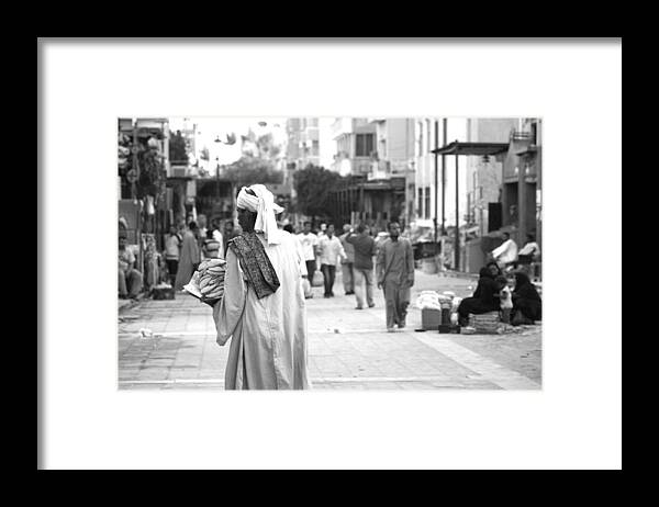 Egypt Framed Print featuring the photograph Aswan street seller by Laura Hiesinger