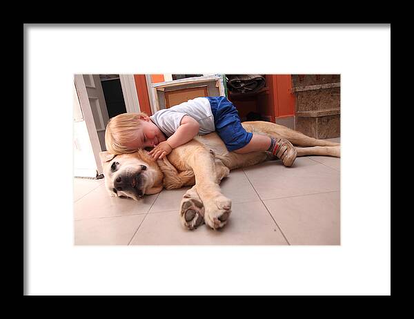 Pets Framed Print featuring the photograph Baby on a dog, cares about dog by Aitor Diago