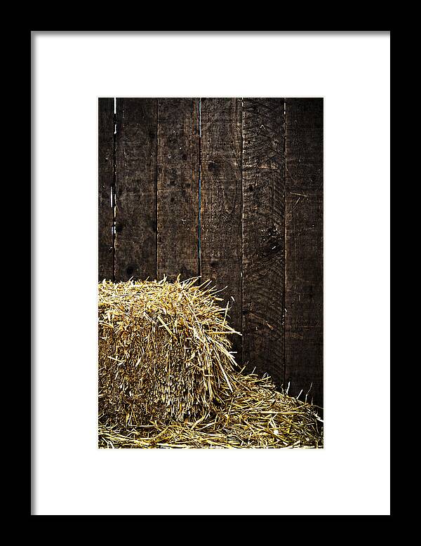 Straw Framed Print featuring the photograph Bale of straw and wooden background by Dutourdumonde Photography