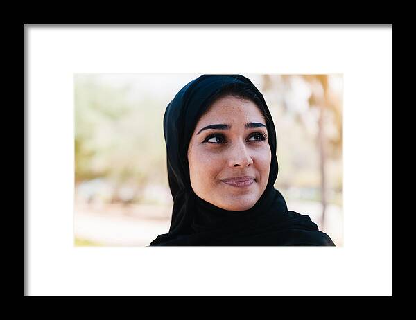 Young Men Framed Print featuring the photograph Beautiful Arab woman in smiling portrait outdoor by Serts
