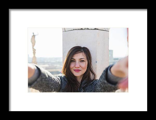 People Framed Print featuring the photograph Beautiful woman takes a selfie by Deimagine
