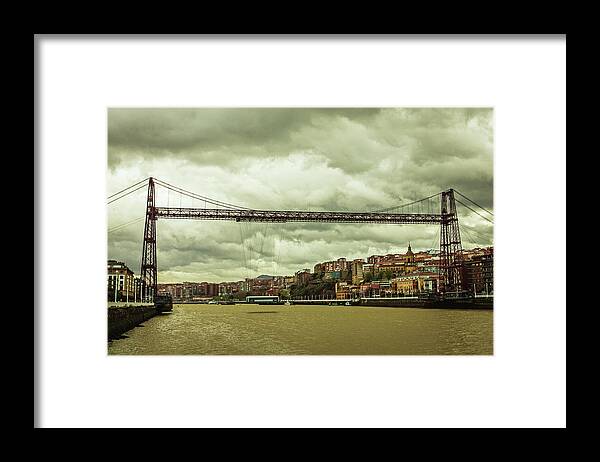 Tranquility Framed Print featuring the photograph Bizkaiko Zubia Bridge On A Cloudy Day by Francisco Goncalves