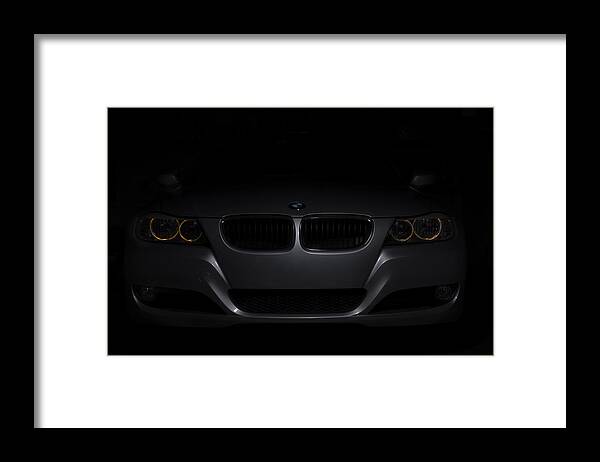 Car Framed Print featuring the photograph BMW Car in black background by Paulo Goncalves