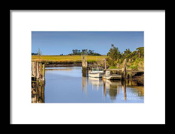 Water Framed Print featuring the photograph Boat Dock by Charles Aitken