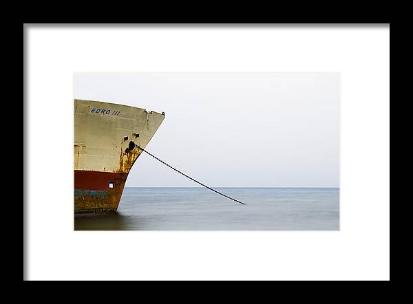 Seascape Framed Print featuring the photograph Abandoned ship on the ocean by Michalakis Ppalis