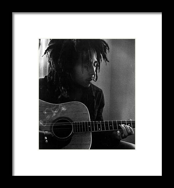 Retro Images Archive Framed Print featuring the photograph Bob Marley Leaning Over Guitar by Retro Images Archive