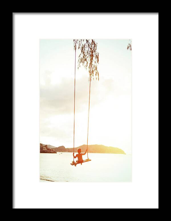 Rope Swing Framed Print featuring the photograph Boy On A Rope Swing by Arand