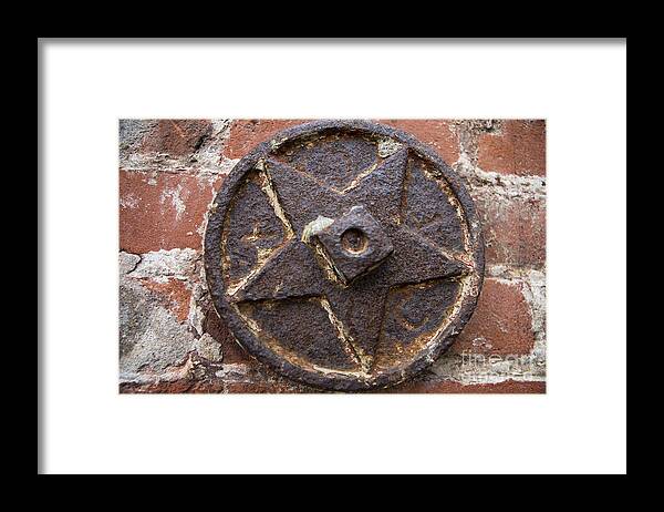  Framed Print featuring the photograph Bronze Star Attached to Brick by Jason O Watson