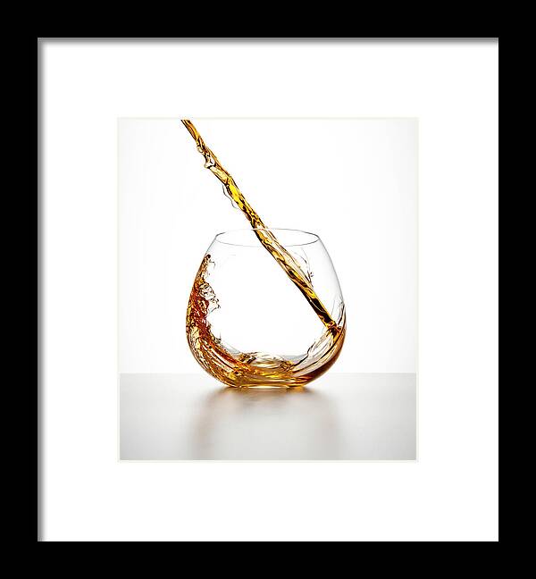 White Background Framed Print featuring the photograph Brown Liquor Streaming Into A Glass by Chris Stein