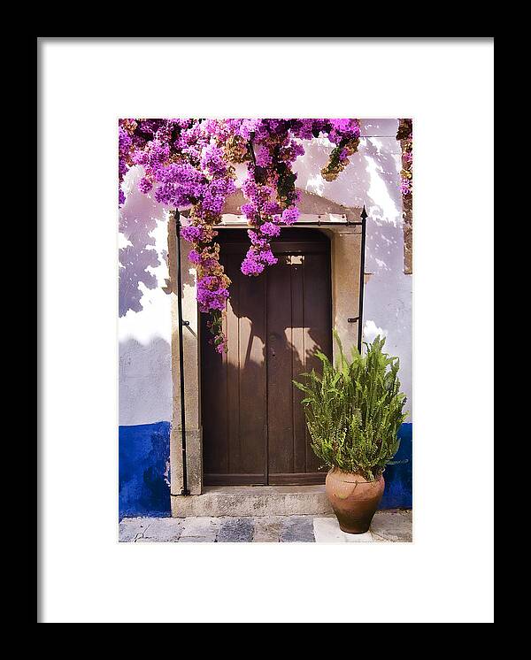 Blue Framed Print featuring the photograph Brown Wood Door of the Medieval Village of Obidos by David Letts